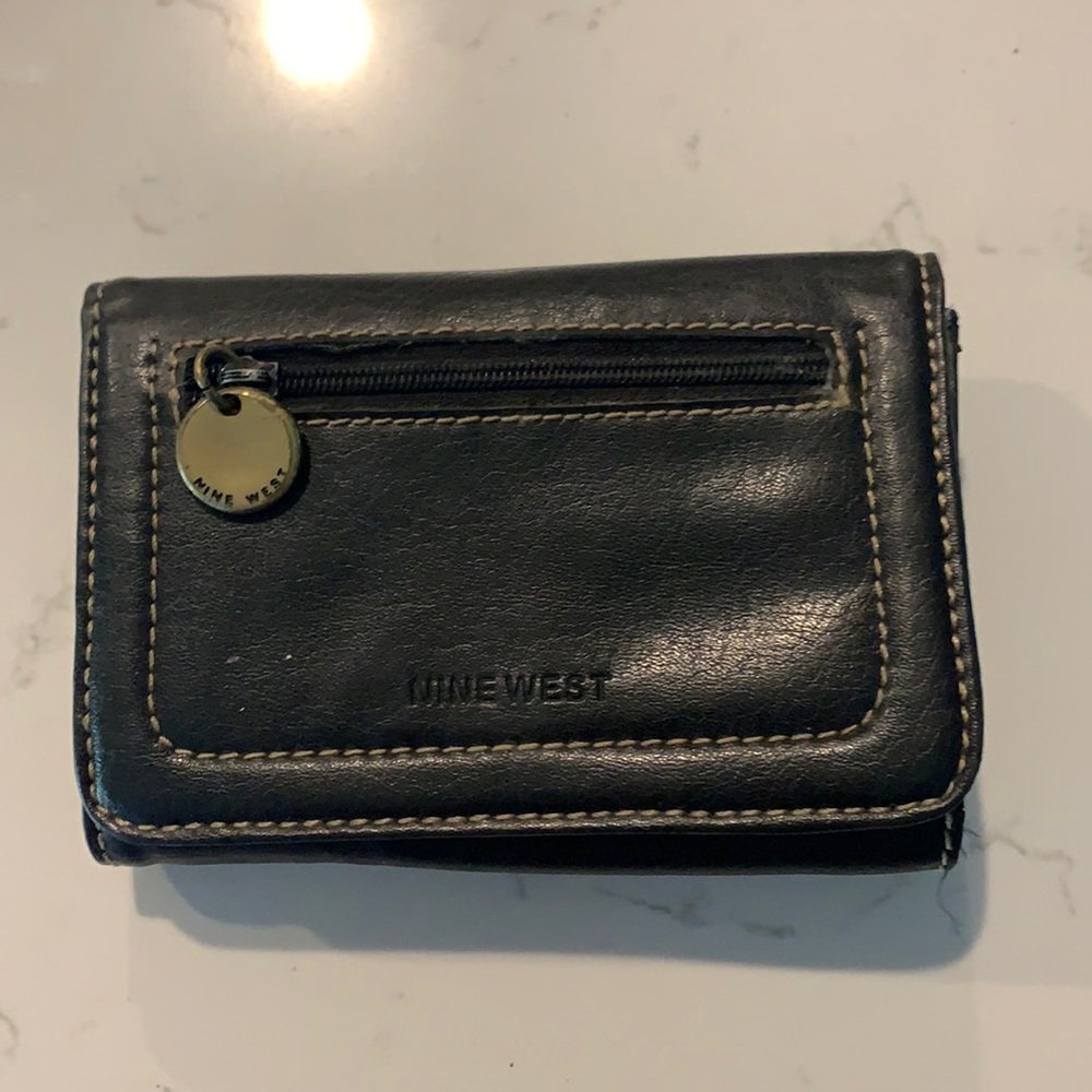 super cute black trifold wallet with lots of different pouches!!